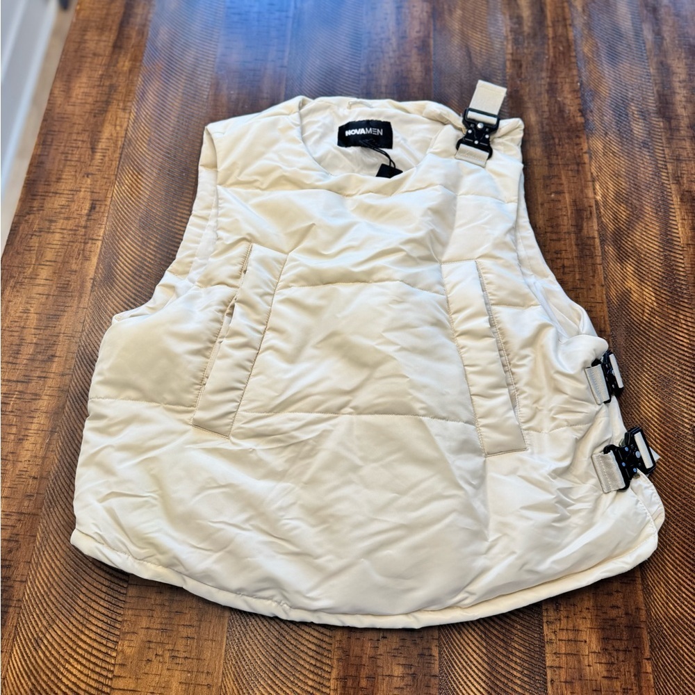 Roller Coaster Puffer Vest" in Off White from the brand Fashion Nova. - Picture 6 of 10